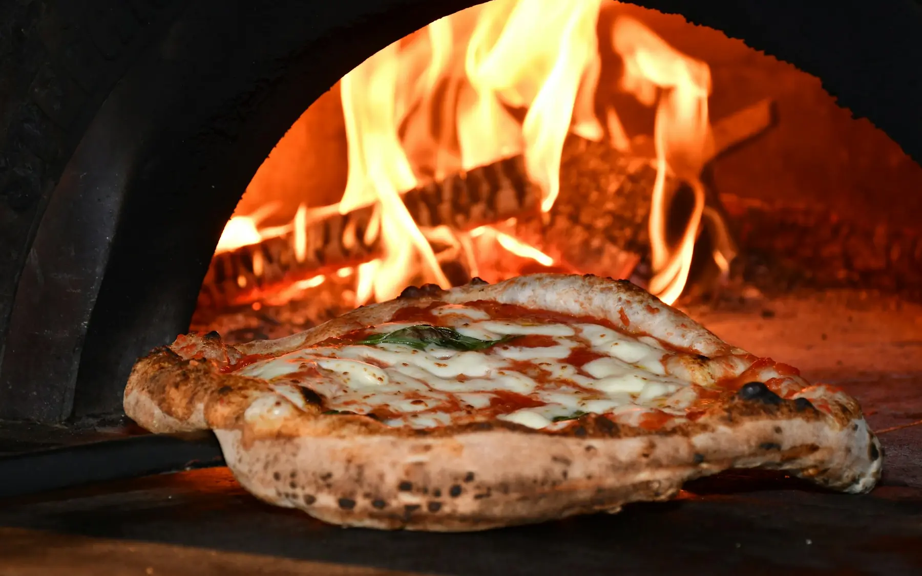 Pizza in the wood-fired oven